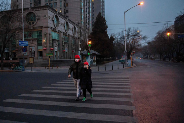 Đường phố Bắc Kinh vắng lặng trong ngày 27-1 giữa mùa dịch virus corona - Ảnh: AFP